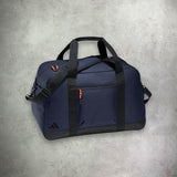 adidas Duffle Bag in navy blue, featuring a spacious main compartment and durable construction for convenient sports or travel use.