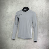 Nike Academy Drill Half Zip in grey, featuring a streamlined design with moisture-wicking fabric for performance and style.