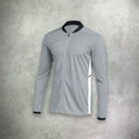 Nike Academy Drill Track Jacket in grey, featuring a lightweight, moisture-wicking design for a sleek and athletic look.