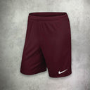 Nike Dri-Fit T-Shirt and Shorts Set in maroon red, featuring moisture-wicking fabric for comfort and a bold, athletic style.