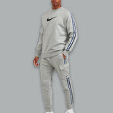 Nike Repeat Cargo Tracksuit Set in grey, featuring a stylish design with a cargo-inspired fit and comfortable athletic performance.