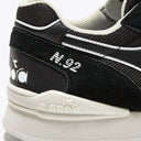 Diadora N.92 Advance Trainer in black and white, featuring a retro-inspired design with modern cushioning for style and comfort from StockUK