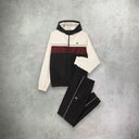 Lacoste Diamond Taffeta Tennis Tracksuit Set in black, white, and bordeaux, featuring a sporty jacket and matching pants with bold color blocking for a stylish, performance-driven look.