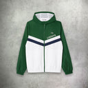 Lacoste Diamond Taffeta Tennis Tracksuit Set in green and white, featuring a sporty jacket and matching pants designed for comfort and performance on the court.